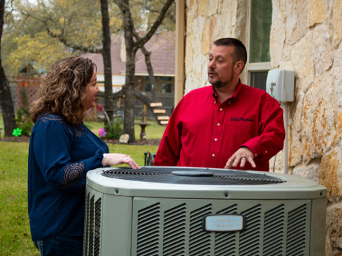 GVEC Technician Discussing HVAC Maintenance with Customer in Gonzales, TX